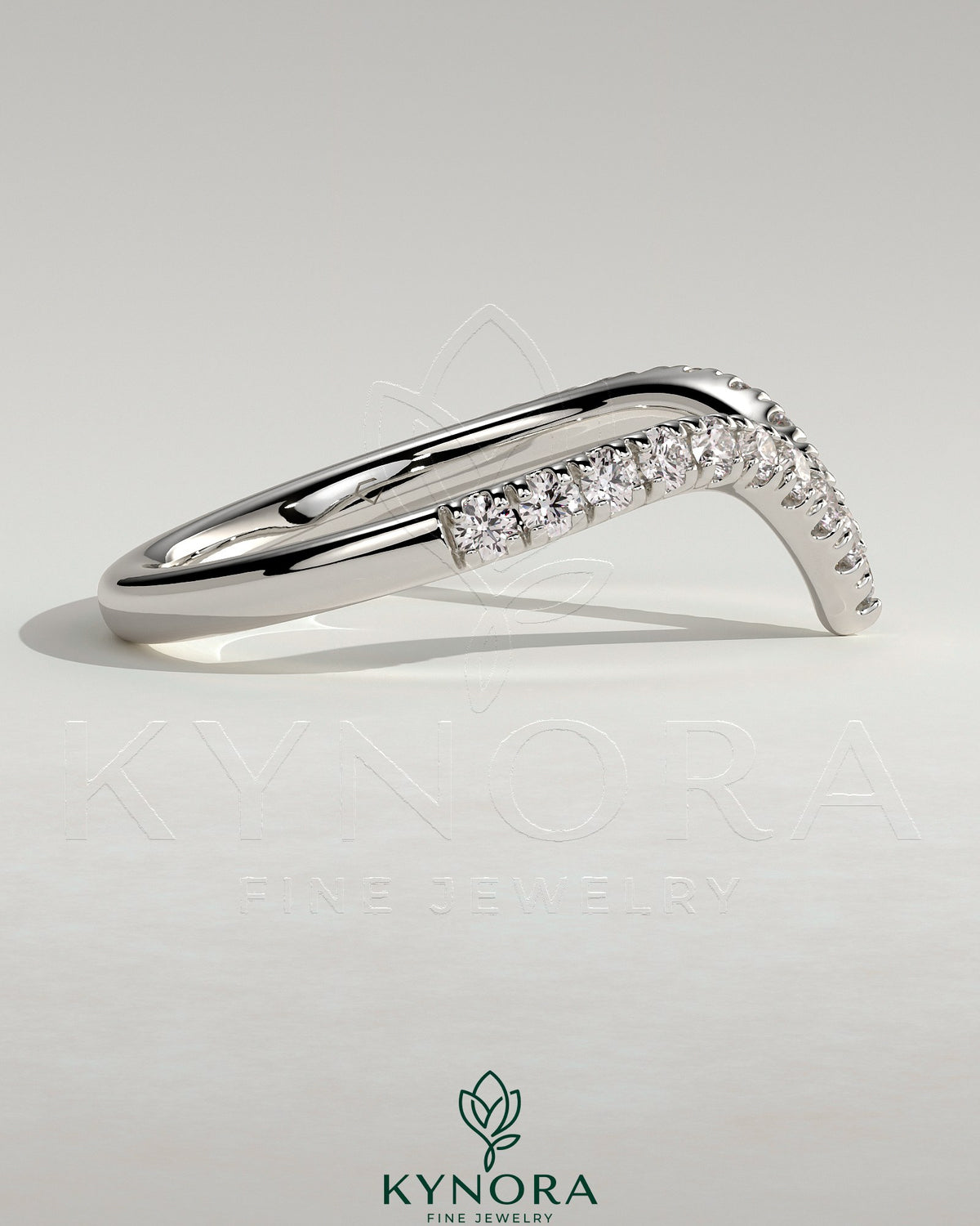 Kynora CJ half pave deep V band wedding ring with sparkling small diamonds and sleek gold finish.