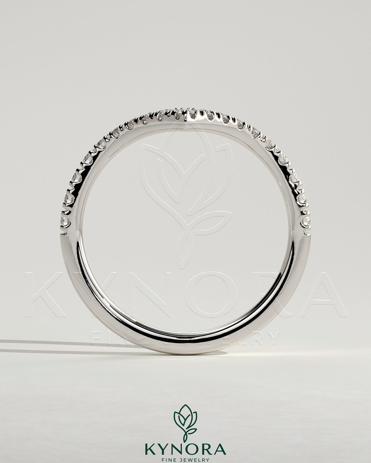Kynora CJ half pave deep V band wedding ring with intricate pave detailing, crafted in elegant gold for special occasions.