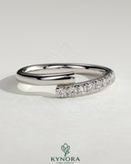 Kynora CJ half pave wrap band wedding ring with sparkling pave setting, elegant gold finish, and sleek, modern design.