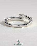 Kynora CJ half pave wrap wedding band ring with intricate diamond detailing and sleek gold finish.