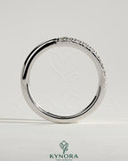 Kynora CJ half pave wrap band wedding ring with intricate pave detailing and a sleek, elegant design.