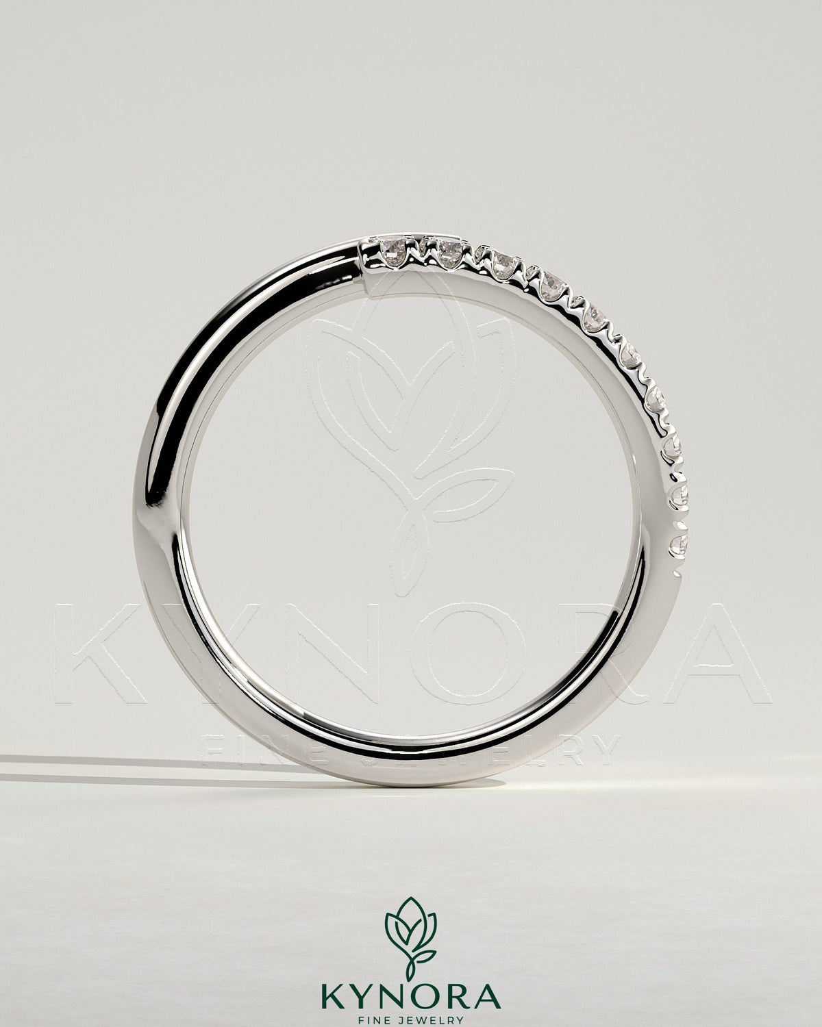 Kynora CJ half pave wrap band wedding ring with intricate pave detailing and a sleek, elegant design.