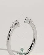 Kynora CJ Kite Accent Stone open band wedding ring featuring sparkling accent stones and a sleek gold finish.