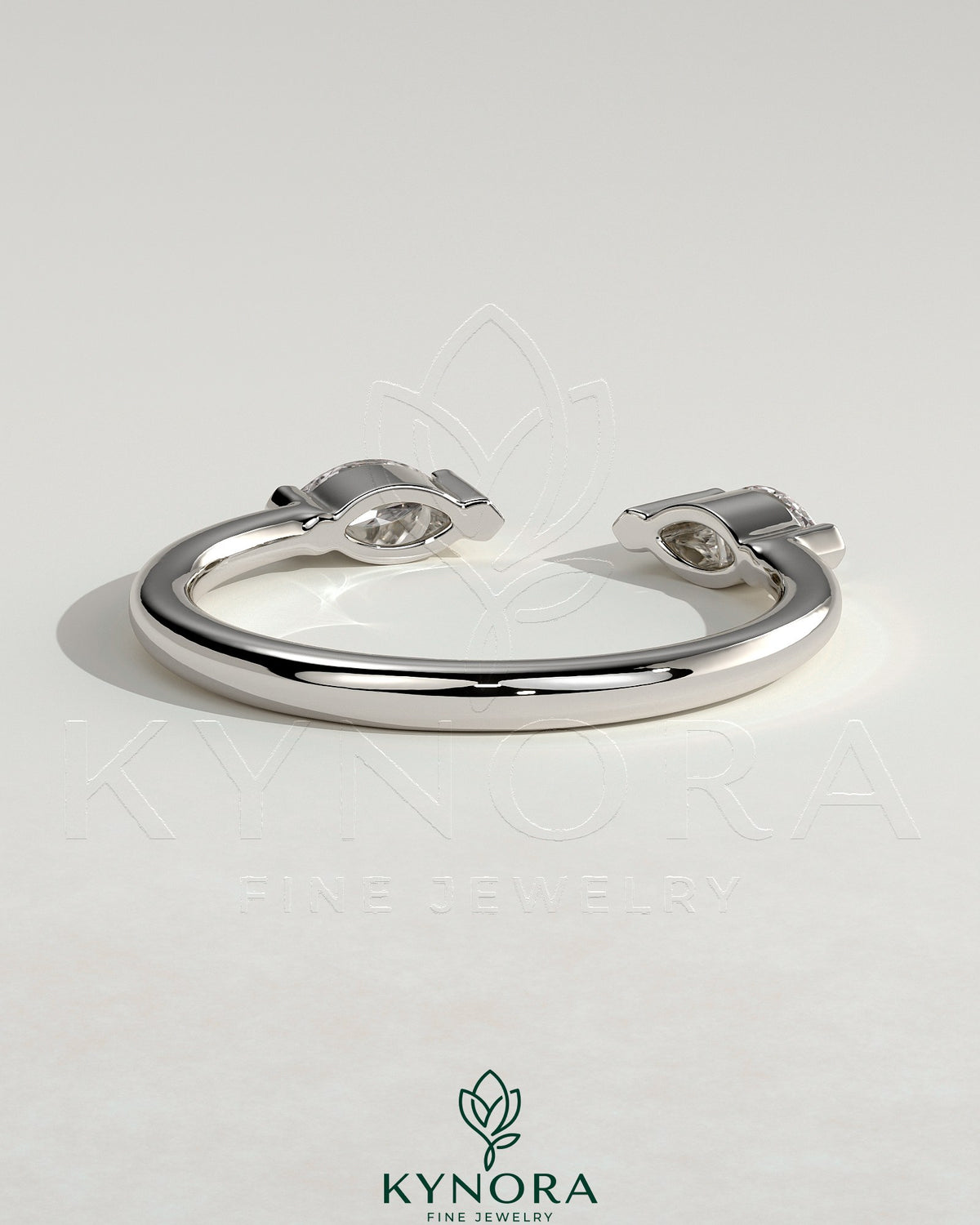 Kynora CJ Marquise Accent Stone open band wedding ring with marquise-shaped stones on a sleek gold band for elegant bridal jewelry.