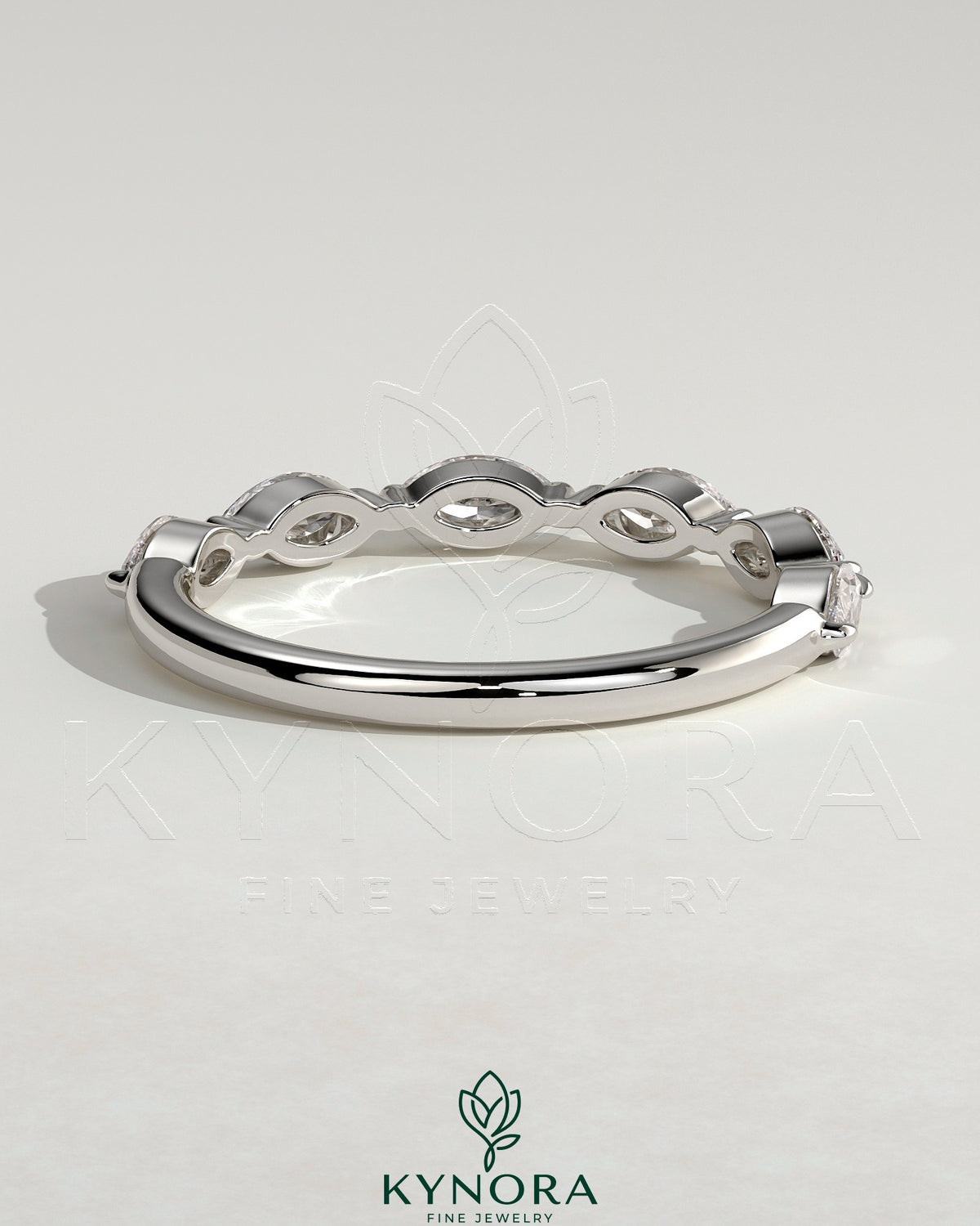 Kynora CJ Marquise Accent Stone Wedding Band featuring marquise-shaped accents and sparkling stones on a sleek gold wedding ring