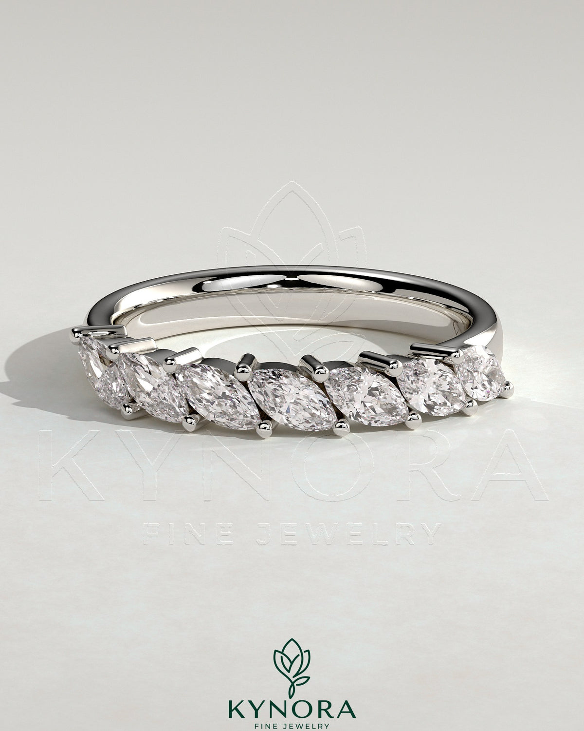 Kynora CJ Marquise East West Accent Stone wedding band with closed basket setting, elegant gold wedding ring with marquise stones. Imagen principal del producto