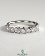 Kynora CJ Marquise East West Accent Stone wedding band with closed basket setting, elegant gold wedding ring with marquise stones.