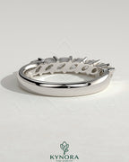Kynora CJ Marquise East West Accent Wedding Band with closed basket setting, featuring marquise-shaped stones in a elegant gold band.