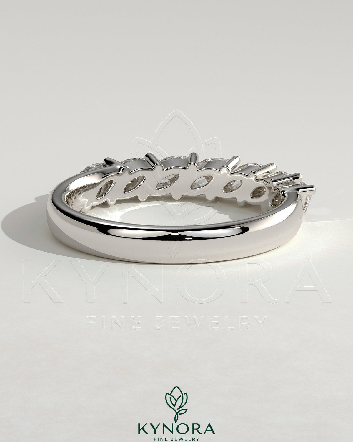 Kynora CJ Marquise East West Accent Wedding Band with closed basket setting, featuring marquise-shaped stones in a elegant gold band.