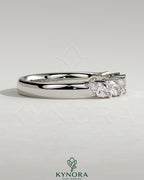 Kynora CJ Marquise East West accent wedding band with closed basket setting, featuring sparkling marquise stones in a elegant gold band.