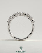 Kynora CJ Marquise East West Accent Wedding Band with closed basket setting featuring marquise-cut accent stones.