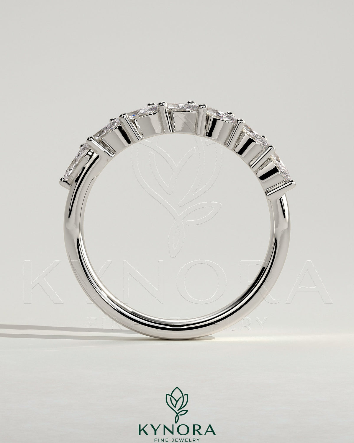 Kynora CJ Marquise East West Accent Wedding Band with closed basket setting featuring marquise-cut accent stones.