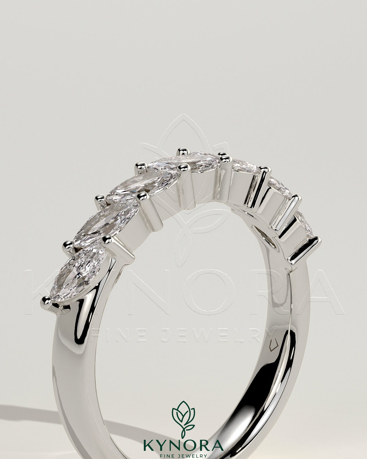 Kynora CJ Marquise East West accent wedding band with closed basket setting, featuring sparkling marquise-shaped stones.