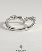 Kynora CJ wedding band featuring marquise-round accent stones with a vine design in sterling silver.