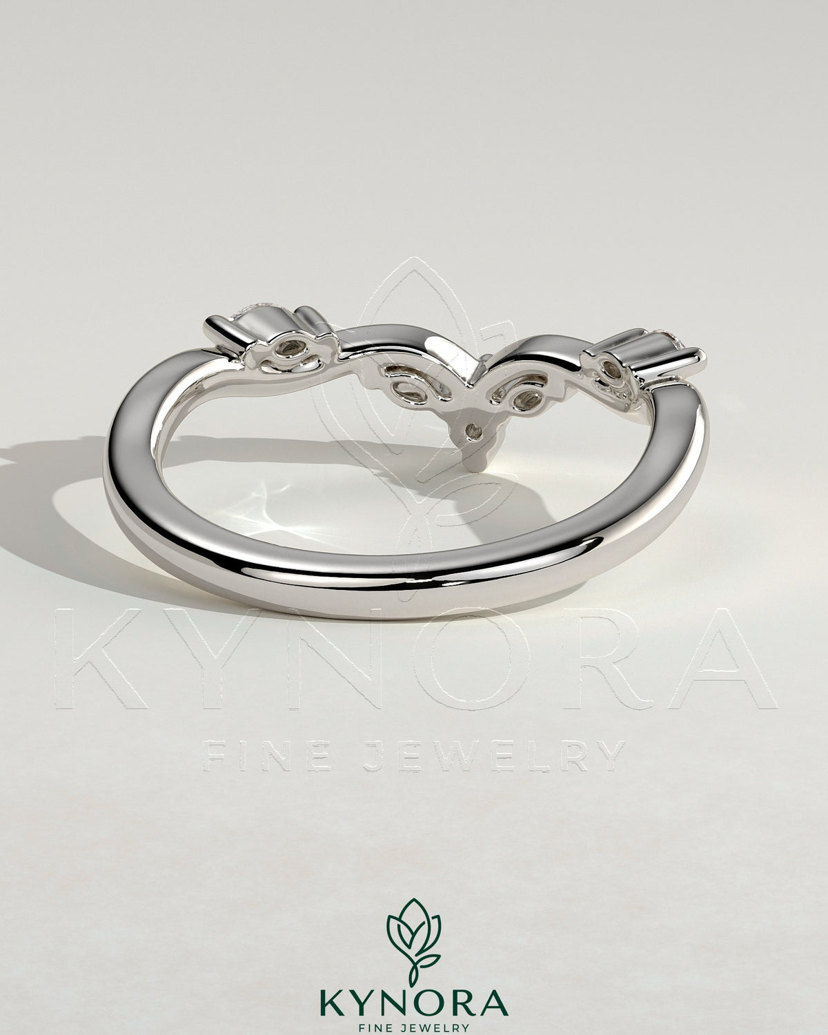 Kynora CJ wedding band featuring marquise-round accent stones with a vine design in sterling silver.