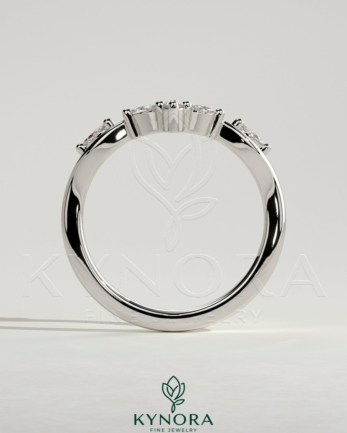 Kynora CJ wedding band with marquise and round accent stones in a vine design, elegant and sparkling gold ring for special occasions