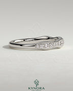Mixed size pave band wedding ring with milgrain detail by Kynora CJ, featuring sparkling pavé stones on a gold band.