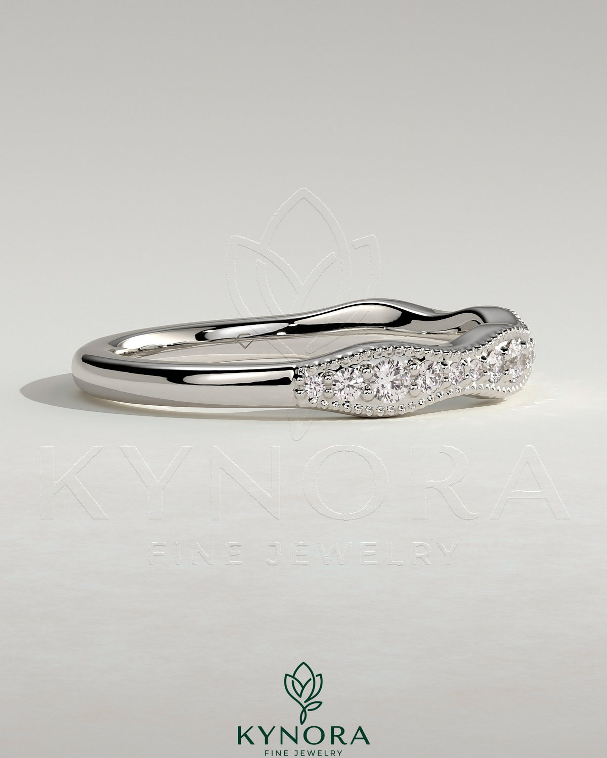 Mixed size pave band wedding ring with milgrain detail by Kynora CJ, featuring sparkling pavé stones on a gold band.