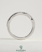 Mixed size pave band wedding ring with milgrain detailing by Kynora CJ, featuring sparkling pavé stones and intricate milgrain edges.