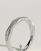 Kynora CJ mixed size pave band wedding ring with milgrain detail, showcasing a sparkling, elegant gold band for special occasions.