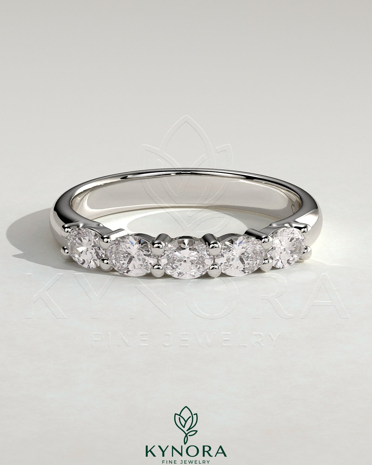 Kynora CJ sterling silver wedding band with oval east-west moissanite accent stone in closed basket setting Imagen principal del producto
