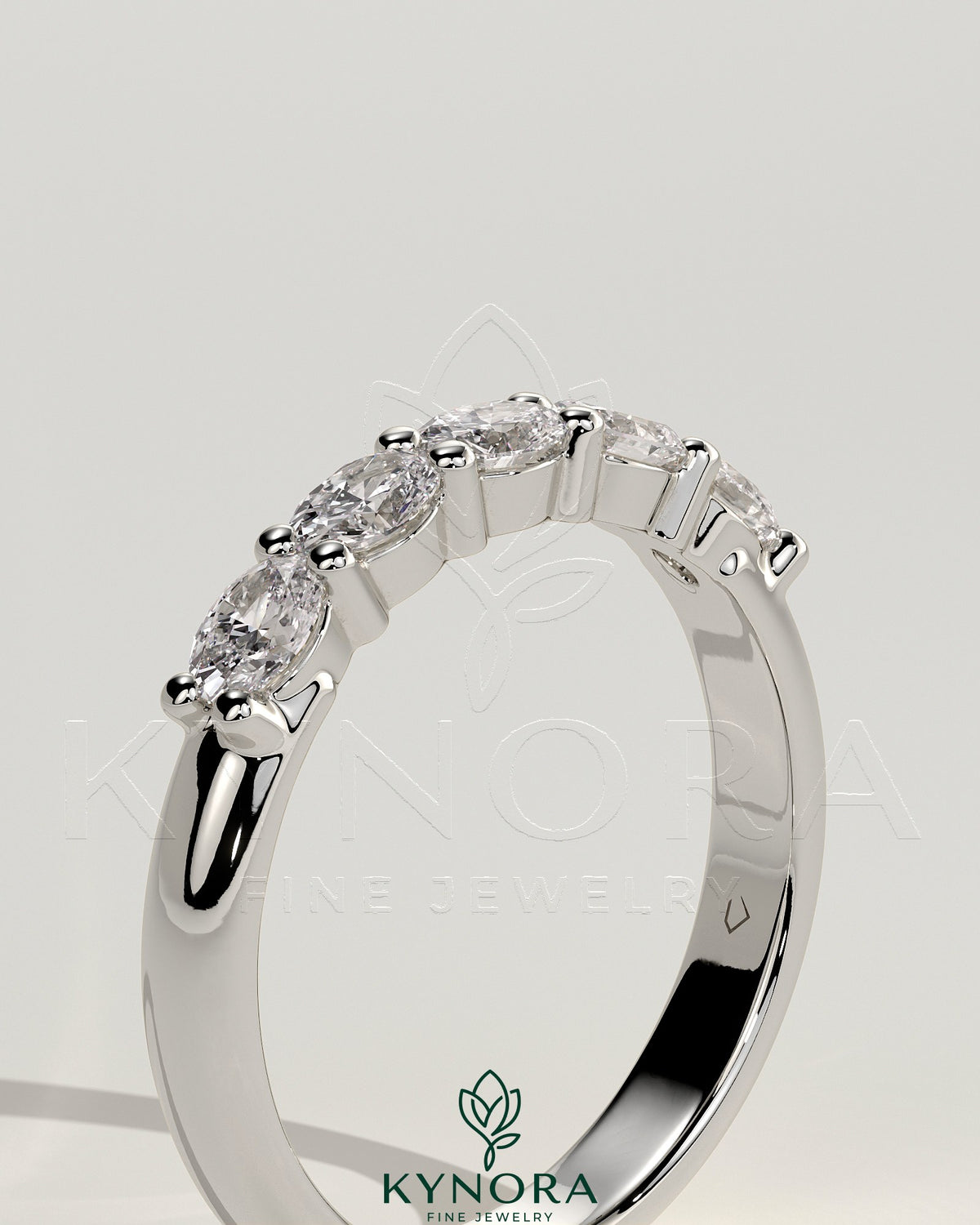 Kynora CJ sterling silver wedding band with oval east-west moissanite accent stone in closed basket setting