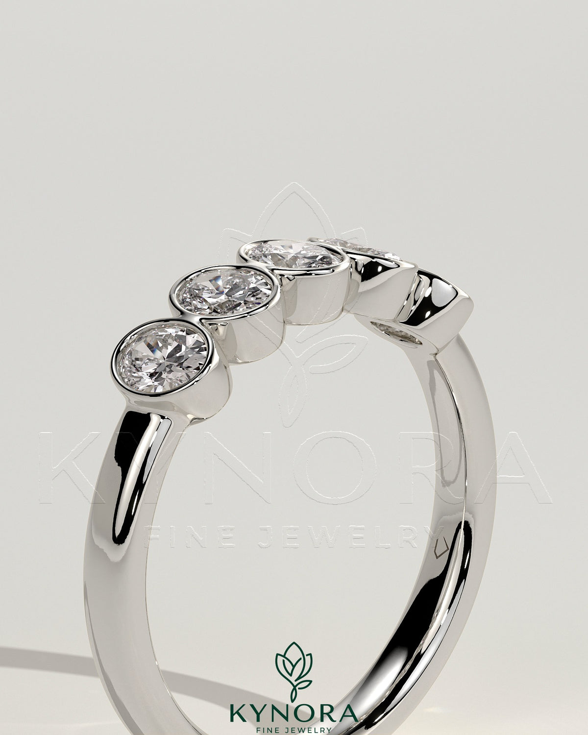 Kynora CJ oval bezel set wedding ring with a sleek band, featuring a central oval gemstone in a modern wedding band design.