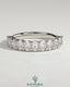 Kynora CJ Oval Eternity Band wedding ring with oval-shaped design and sparkling gemstones, crafted in elegant jewelry style.