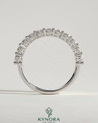 Kynora CJ oval eternity wedding band ring with continuous sparkling gemstone design on polished metal band