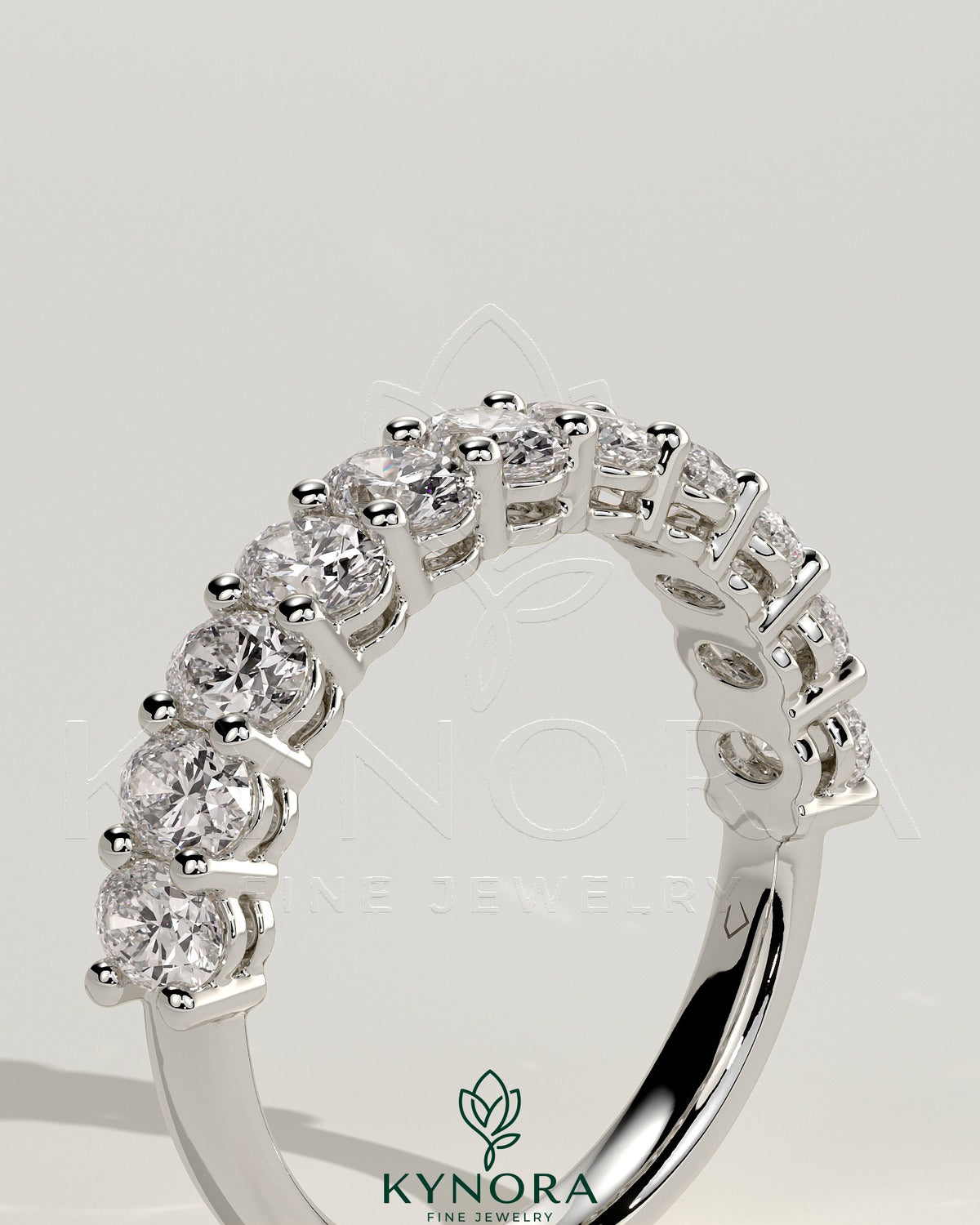 Kynora CJ oval eternity wedding band ring with sparkling gemstones, crafted in elegant eternity design.
