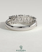 Kynora CJ Pear Alternating Half Eternity Wedding Band with closed basket setting, featuring alternating pear-shaped diamonds.