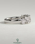 Kynora CJ pear alternating eternity wedding band with half pear-shaped stones in closed basket setting, crafted for elegance.