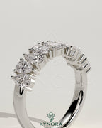 Kynora CJ Pear Alternating Half Eternity Wedding Band with closed basket setting, featuring pear-shaped diamonds on a polished gold band