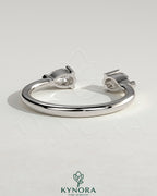 Kynora CJ Pear Accent Stone open band wedding ring with pear-shaped gemstones and sleek gold finish.