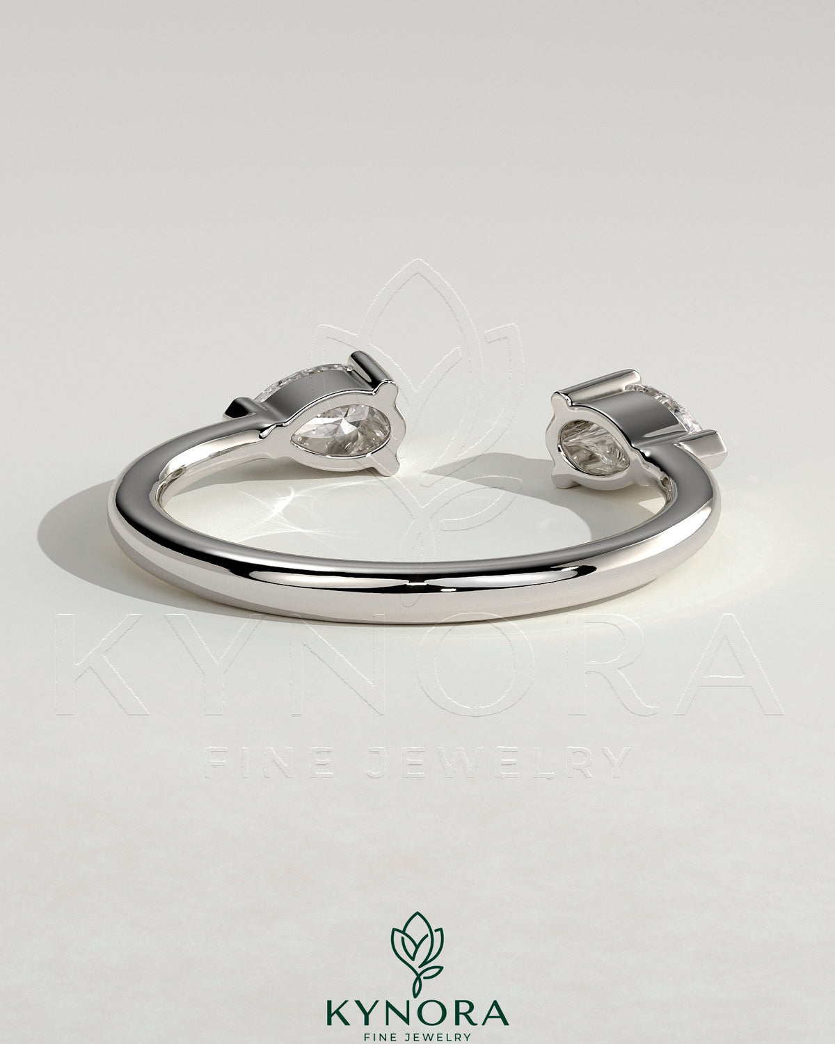 Kynora CJ Pear Accent Stone open band wedding ring with pear-shaped gemstones and sleek gold finish.