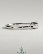 Kynora CJ Pear Pear accent stone open band wedding ring with elegant design and sparkling stones on a sleek silver band.