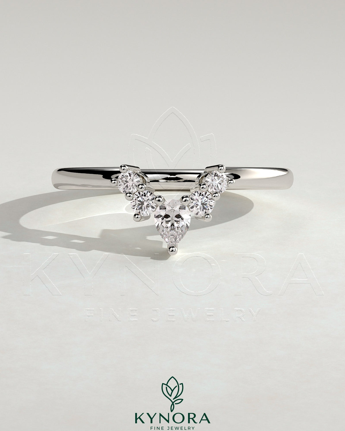 Kynora CJ Pear round accent stone wedding band with curved design, elegant gold wedding ring featuring sparkling gemstones. Main image