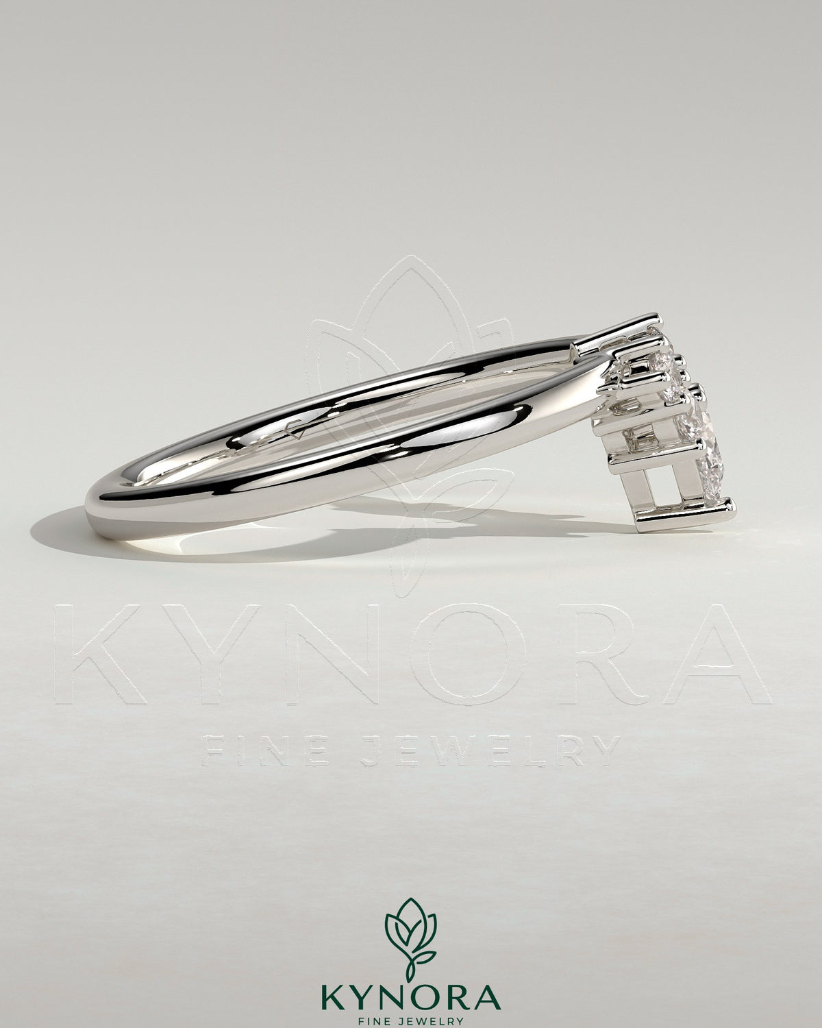 Kynora CJ Pear-shaped accent stone wedding band with curved design in silver, elegant jewelry for special occasions.
