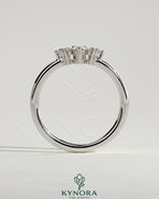 Kynora CJ Pear Round Accent Stone wedding band with curved design, elegant silver wedding ring featuring sparkling stones.