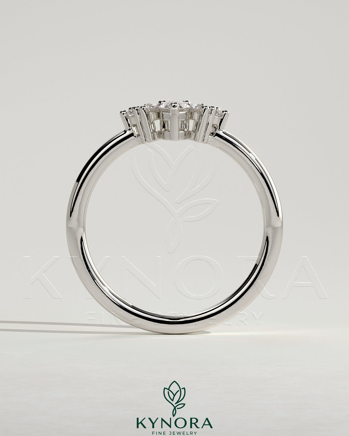 Kynora CJ Pear Round Accent Stone wedding band with curved design, elegant silver wedding ring featuring sparkling stones.