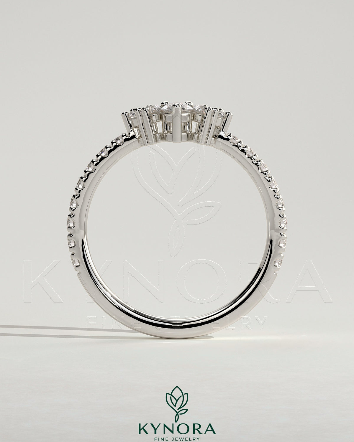 Kynora CJ Pear-shaped accent stone wedding band with curved pave band, elegant gold wedding ring with detailed gemstone setting.