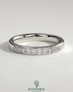 Kynora CJ Princess Princess Channel Set Wedding Ring in sterling silver, featuring a sleek band with embedded princess-cut stones