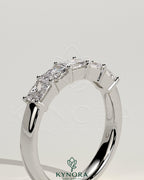 Kynora CJ Radiant East West Accent Stone wedding band with closed basket setting, showcasing sparkling gemstones and elegant design.