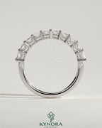 Kynora CJ Radiant Eternity Band wedding ring with sparkling gemstones, featuring a continuous row of brilliance on polished gold.