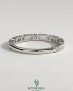 Kynora CJ round baguette wedding band with accent stones and milgrain detailing, elegant wedding ring for special occasions.
