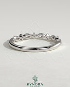Kynora CJ round marquise accent wedding band with sparkling marquise-shaped stones on a sleek gold ring.