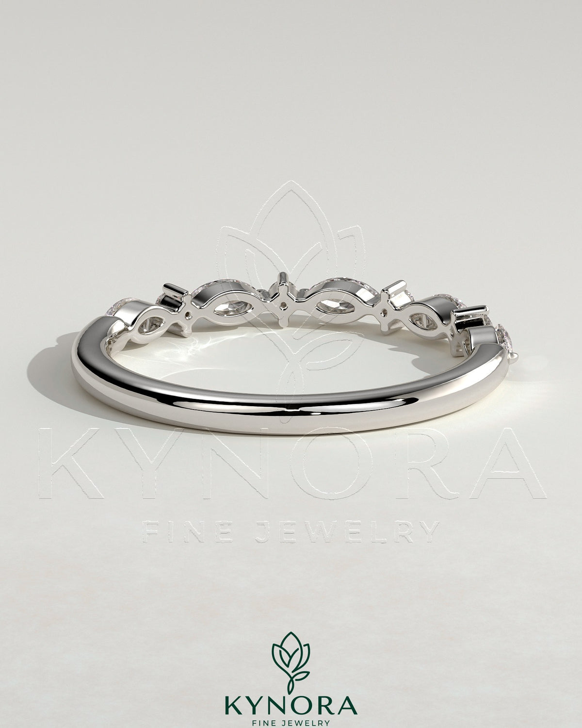 Kynora CJ round marquise accent wedding band with sparkling marquise-shaped stones on a sleek gold ring.