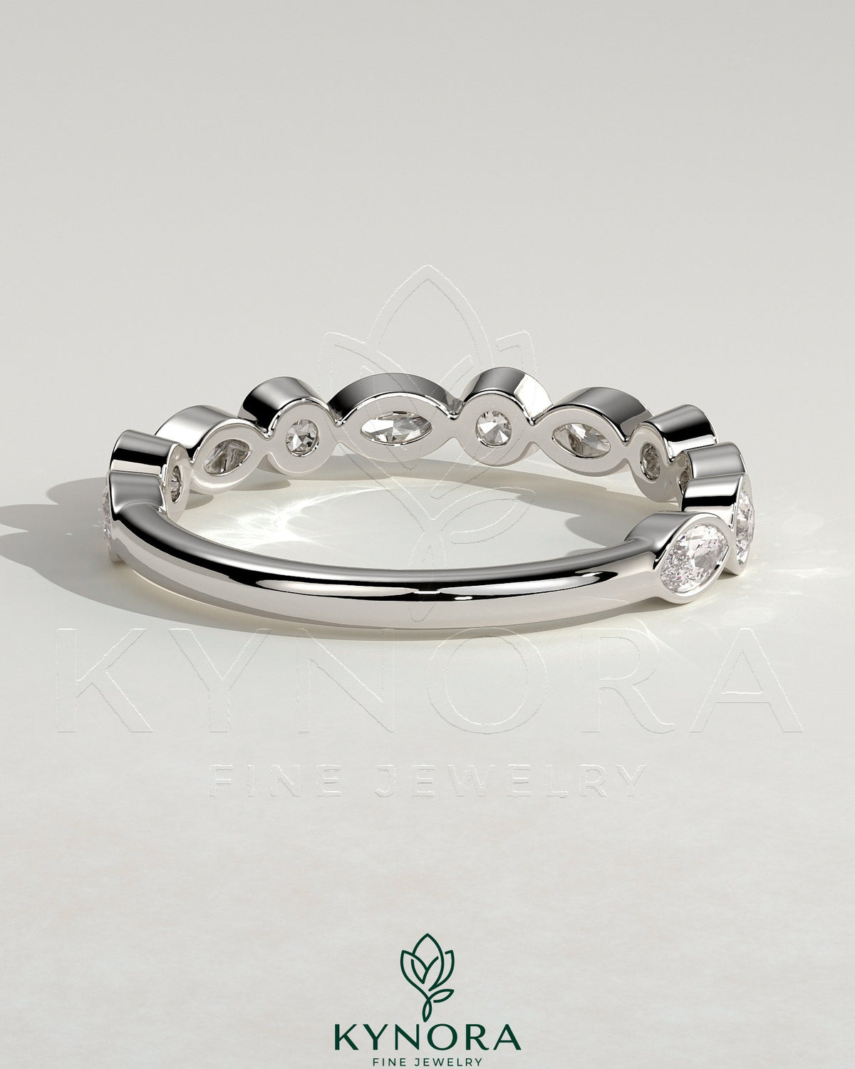 Kynora CJ round marquise bezel set wedding ring featuring a sleek band with marquise-shaped stones for elegant wedding jewelry