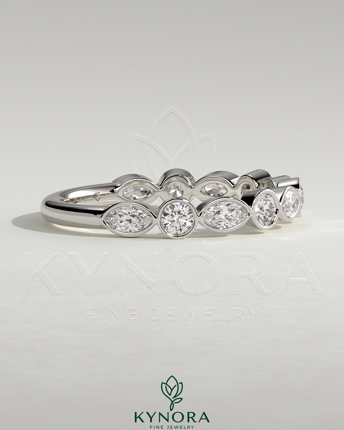 Kynora CJ round marquise bezel set wedding ring with sparkling marquise-shaped gemstones on a sleek band.