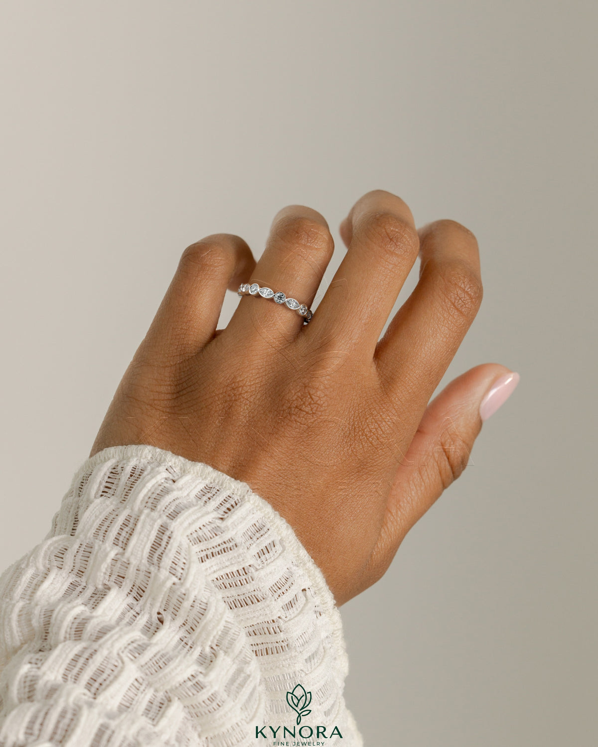 Kynora CJ round marquise wedding band with bezel-set marquise diamonds, elegant and sparkling bridal ring.